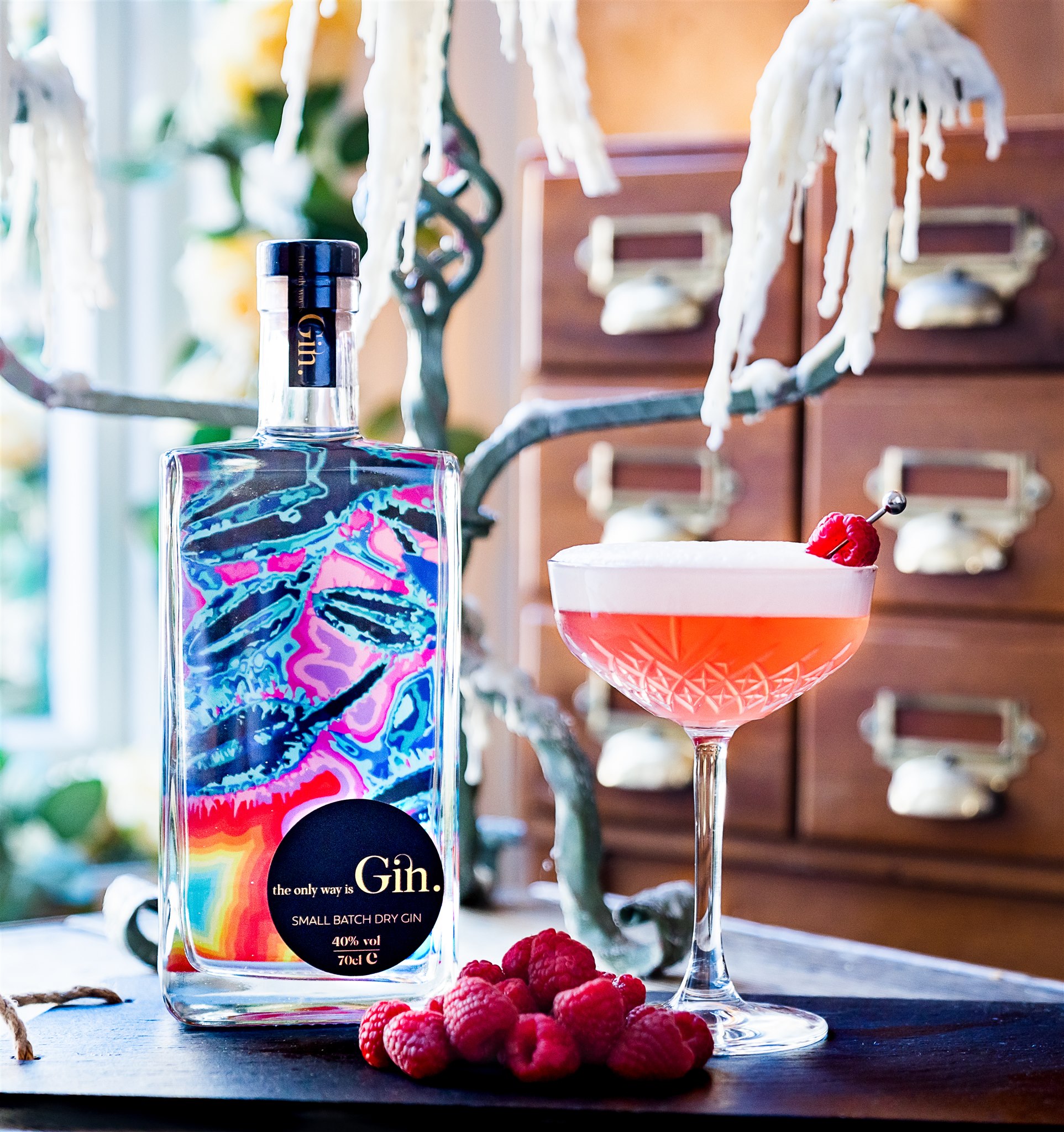 Gin cocktail with brightly coloured bottle